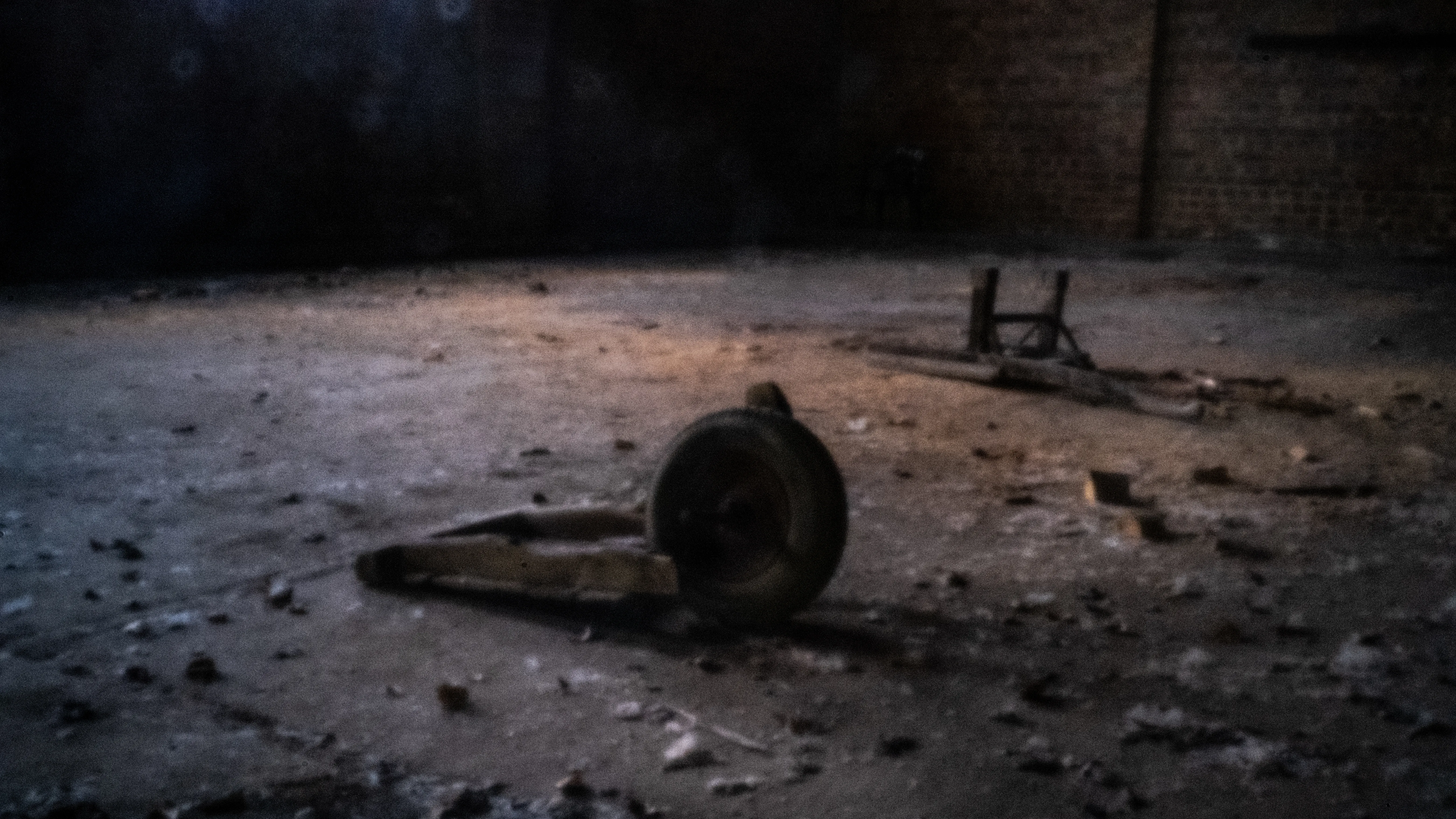 Factory interior with an abandoned wheel and grit