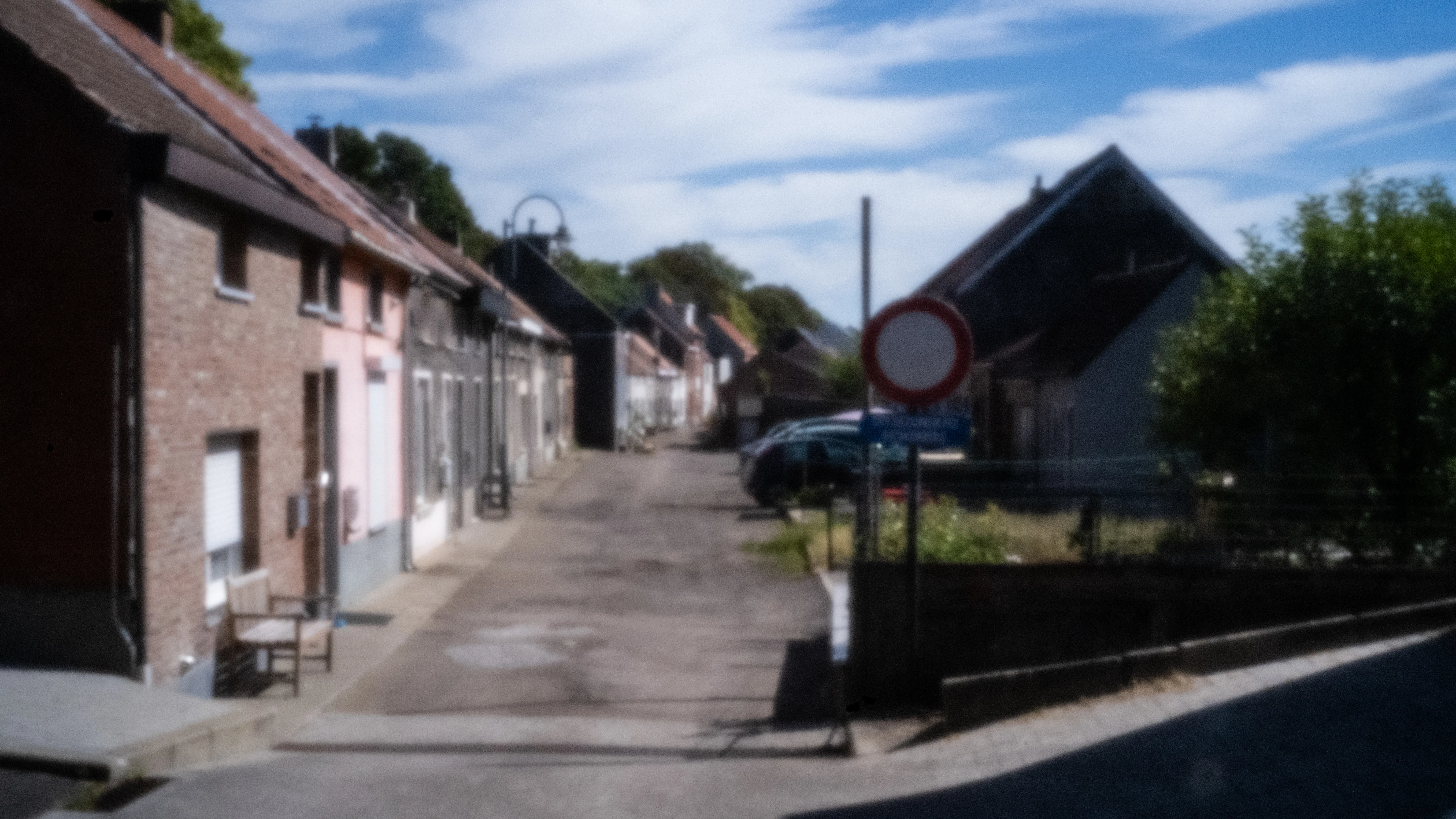 Village street in Noeveren with parked cars